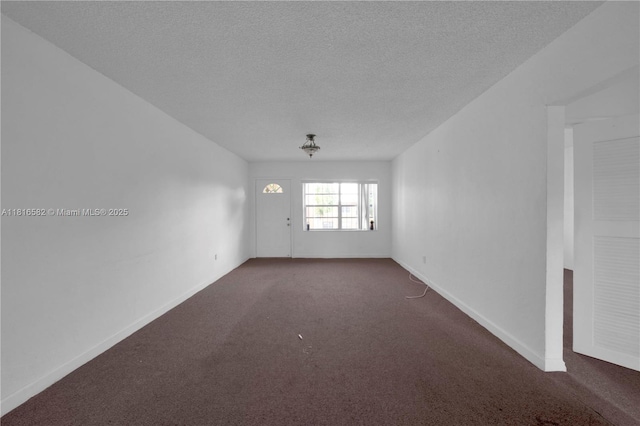 3401 SW 10th St Unit 2B, Miami, FL 33135 - carpeted empty room with a textured ceiling and baseboards