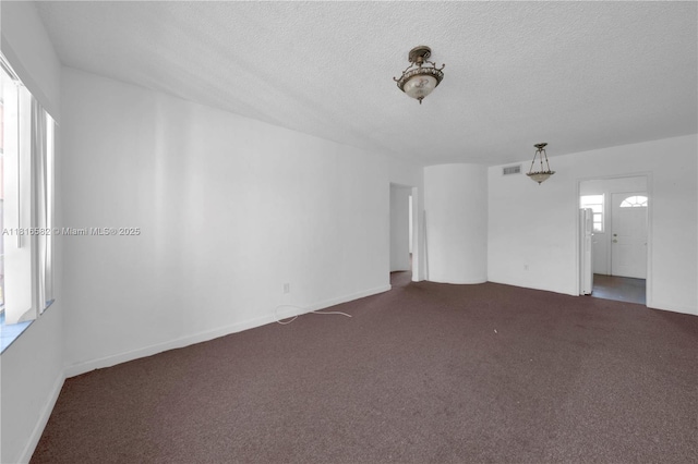 3401 SW 10th St Unit 2B, Miami, FL 33135 - carpeted spare room featuring a textured ceiling