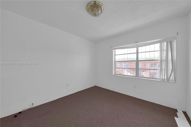 3401 SW 10th St Unit 2B, Miami, FL 33135 - unfurnished room featuring carpet flooring and a textured ceiling