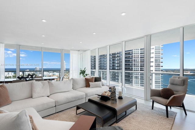 450 Alton Rd Unit 2007, Miami Beach, FL 33139 - living room featuring a water view, a wall of windows, and recessed lighting