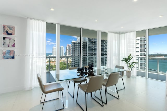 450 Alton Rd Unit 2007, Miami Beach, FL 33139 - dining room with healthy amount of natural light, a view of city, floor to ceiling windows, recessed lighting, and tile patterned flooring
