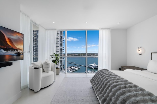 450 Alton Rd Unit 2007, Miami Beach, FL 33139 - tiled bedroom with expansive windows, a water view, recessed lighting, and access to outside