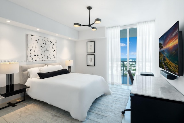 450 Alton Rd Unit 2007, Miami Beach, FL 33139 - bedroom with a chandelier, access to exterior, and recessed lighting