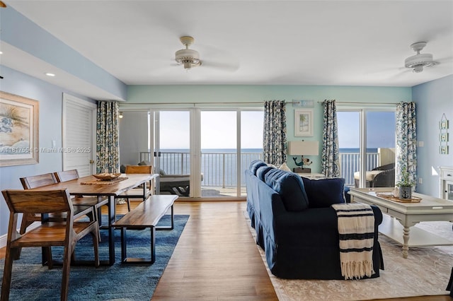 200 Wrenn St Ph 701, Plantation Key, FL 33070 - living area featuring a ceiling fan, wood finished floors, and a water view