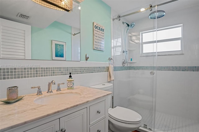 200 Wrenn St Ph 701, Plantation Key, FL 33070 - full bath with toilet, a stall shower, vanity, and tile walls