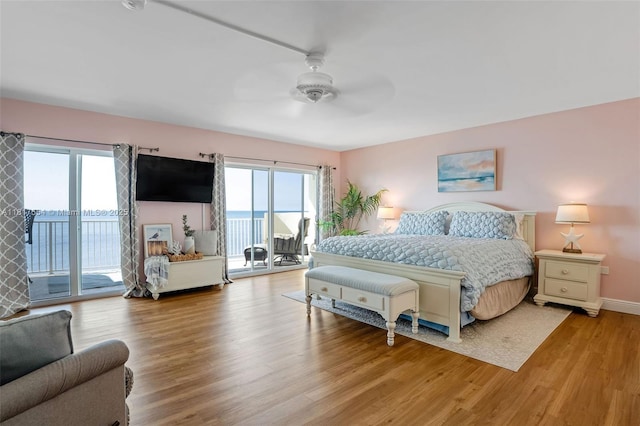 200 Wrenn St Ph 701, Plantation Key, FL 33070 - bedroom with access to outside, multiple windows, and light wood-style floors