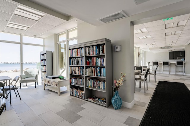 200 Wrenn St Ph 701, Plantation Key, FL 33070 - interior space featuring plenty of natural light, a wall of windows, a drop ceiling, and a water view