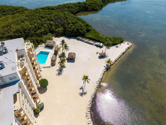 200 Wrenn St Ph 701, Plantation Key, FL 33070 - drone / aerial view of a pool, a nearby body of water, and a heavily wooded area