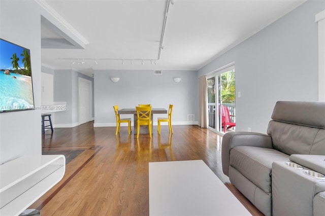 1100 11th St Unit 208, Miami Beach, FL 33139 - living area featuring track lighting, wood finished floors, and baseboards