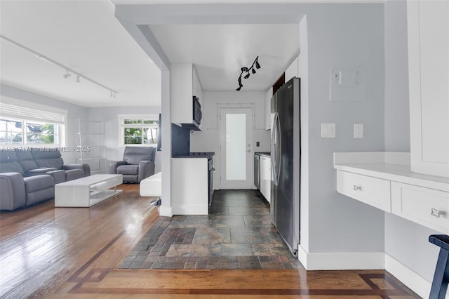 1100 11th St Unit 208, Miami Beach, FL 33139 - kitchen with rail lighting, open floor plan, freestanding refrigerator, and baseboards