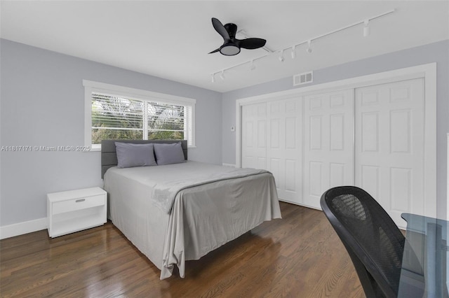 1100 11th St Unit 208, Miami Beach, FL 33139 - bedroom with rail lighting, a closet, dark wood-type flooring, and a ceiling fan