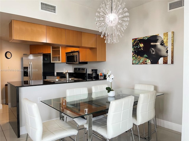 1750 N Bayshore Dr Unit 1414, Miami, FL 33132 - dining room with a chandelier, baseboards, and light tile patterned floors