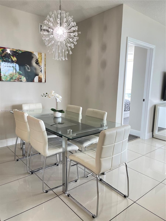 1750 N Bayshore Dr Unit 1414, Miami, FL 33132 - dining space with tile patterned flooring, a textured ceiling, baseboards, and a chandelier