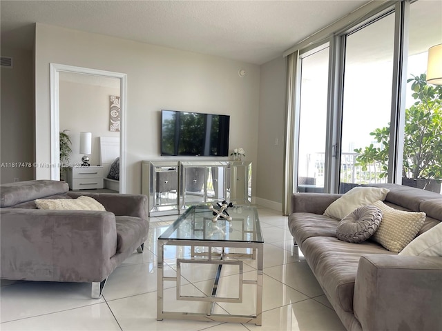 1750 N Bayshore Dr Unit 1414, Miami, FL 33132 - living area with light tile patterned floors, a wall of windows, and baseboards