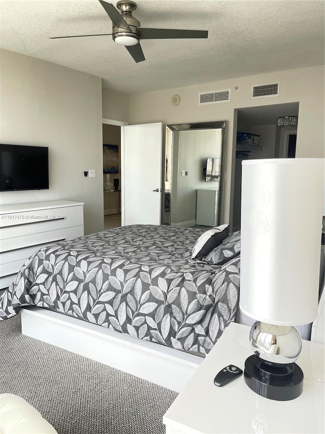 1750 N Bayshore Dr Unit 1414, Miami, FL 33132 - bedroom featuring a textured ceiling and ceiling fan