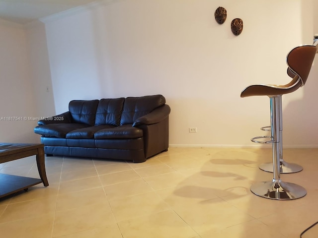 3740 Inverrary Dr Unit 3D, Lauderhill, FL 33319 - living area with crown molding, tile patterned flooring, and baseboards