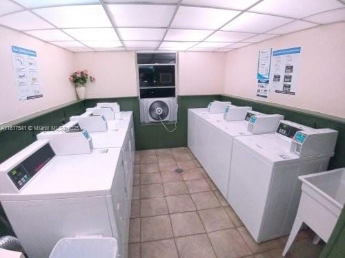 3740 Inverrary Dr Unit 3D, Lauderhill, FL 33319 - community laundry room with separate washer and dryer and light tile patterned floors