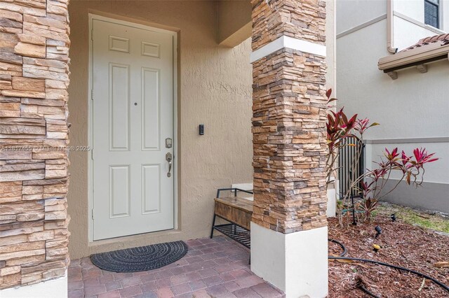 22791 SW 88th Pl, Cutler Bay, FL 33190 - entrance to property with stone siding and stucco siding