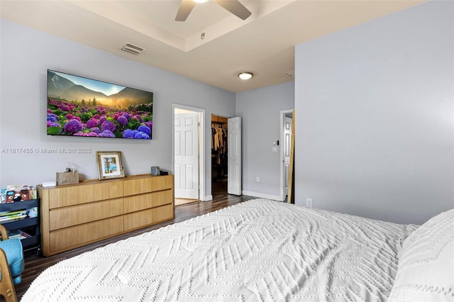 22791 SW 88th Pl, Cutler Bay, FL 33190 - bedroom featuring dark wood-type flooring, a spacious closet, ceiling fan, and a closet