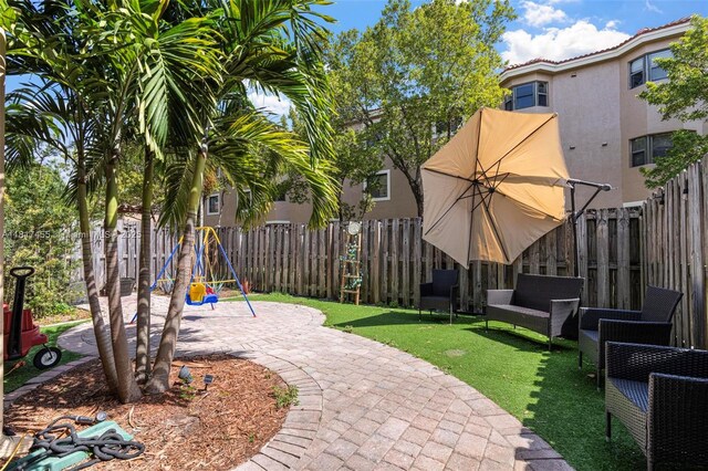 22791 SW 88th Pl, Cutler Bay, FL 33190 - view of yard with a playground and a patio
