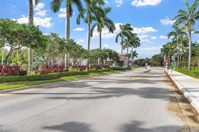 22791 SW 88th Pl, Cutler Bay, FL 33190 - view of asphalt street featuring traffic signs, curbs, and sidewalks