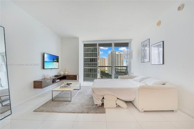 485 Brickell Ave Unit 1801, Miami, FL 33131 - tiled living room with baseboards and expansive windows
