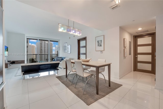 485 Brickell Ave Unit 1801, Miami, FL 33131 - dining area with light tile patterned floors and baseboards