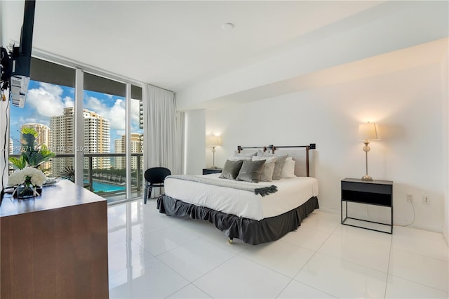 485 Brickell Ave Unit 1801, Miami, FL 33131 - bedroom featuring a wall of windows, tile patterned flooring, access to exterior, and a view of city