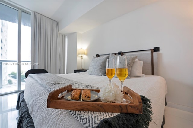 485 Brickell Ave Unit 1801, Miami, FL 33131 - bedroom featuring multiple windows, floor to ceiling windows, and access to outside