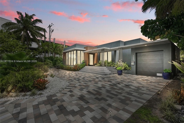 1845 NE 124th St, North Miami, FL 33181 - view of front of home featuring a garage and driveway