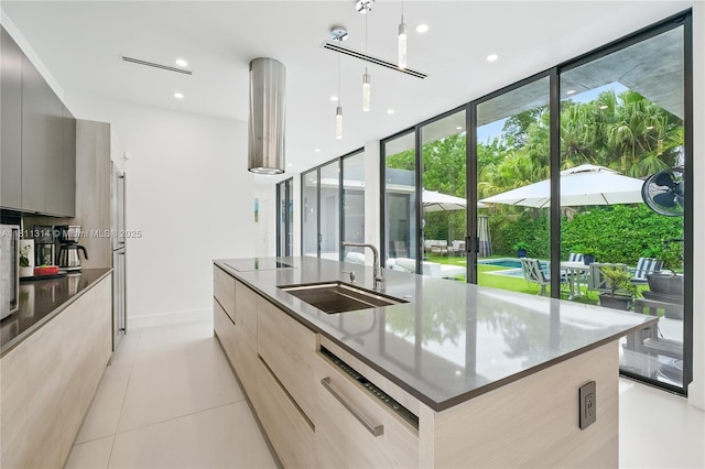 1845 NE 124th St, North Miami, FL 33181 - kitchen featuring modern cabinets, a sink, healthy amount of natural light, a wall of windows, and recessed lighting