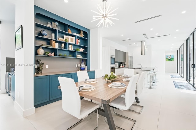 1845 NE 124th St, North Miami, FL 33181 - dining room with a chandelier, built in shelves, light tile patterned floors, and recessed lighting