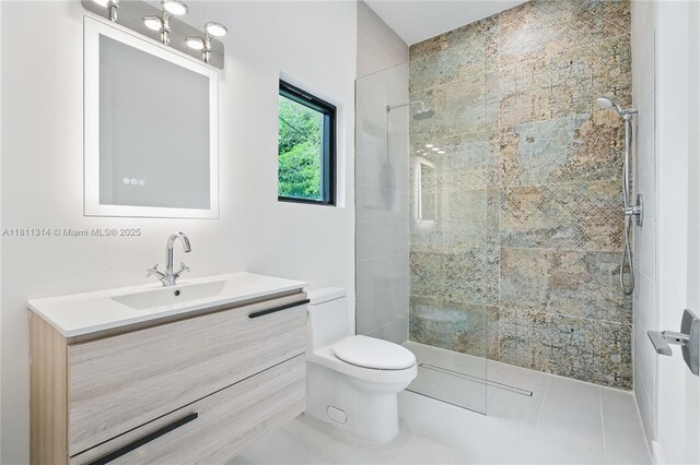 1845 NE 124th St, North Miami, FL 33181 - full bathroom featuring toilet, vanity, a tile shower, and tile patterned flooring