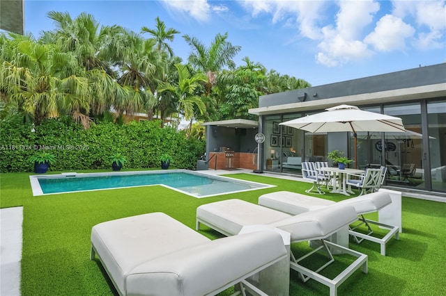 1845 NE 124th St, North Miami, FL 33181 - view of pool with an outdoor kitchen, a yard, and a patio area