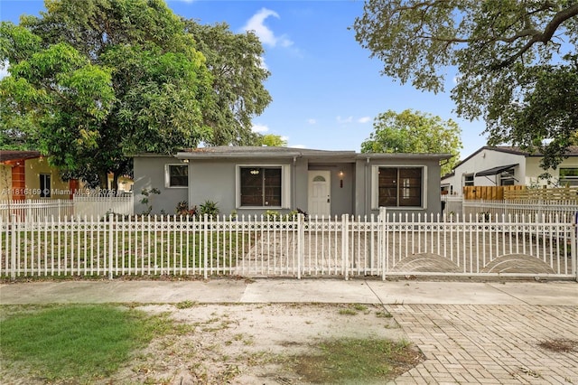 1104 NE 157th St, North Miami Beach, FL 33162 - single story home featuring stucco siding and a fenced front yard