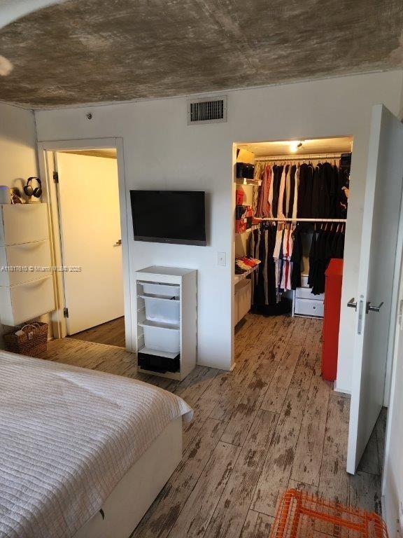 460 S Park Rd Unit 6-209, Hollywood, FL 33021 - bedroom with hardwood / wood-style floors, a spacious closet, and a closet