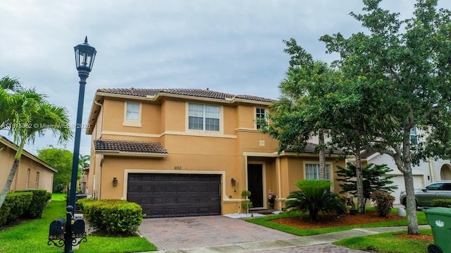 4452 Rainbow Ave, Weston, FL 33332 - multi unit property featuring stucco siding, decorative driveway, a tile roof, and a garage