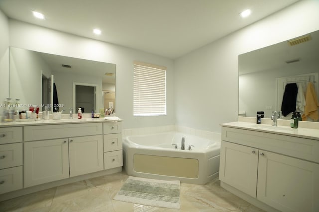 4452 Rainbow Ave, Weston, FL 33332 - full bath featuring marble finish flooring, a bath, two vanities, and recessed lighting