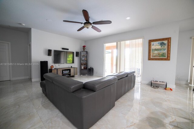4452 Rainbow Ave, Weston, FL 33332 - living area with light marble finish flooring and ceiling fan