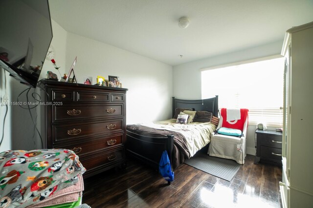 4452 Rainbow Ave, Weston, FL 33332 - bedroom with dark wood-style flooring