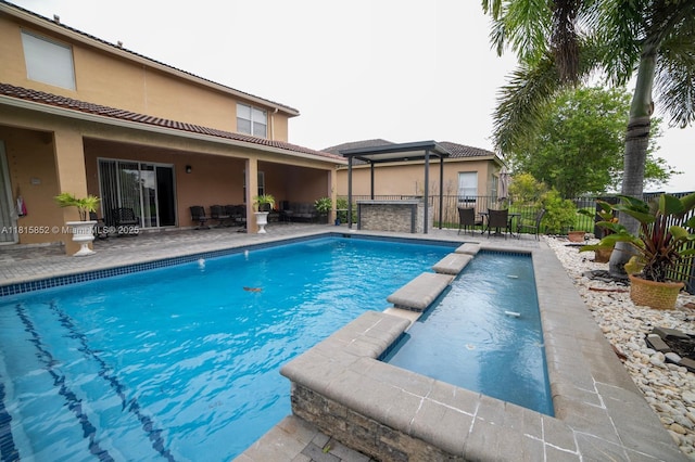 4452 Rainbow Ave, Weston, FL 33332 - view of swimming pool featuring a patio area, a pool with connected hot tub, an outdoor hangout area, and outdoor dining area