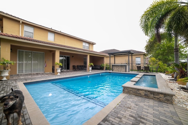 4452 Rainbow Ave, Weston, FL 33332 - view of swimming pool with a patio area and a pool with connected hot tub