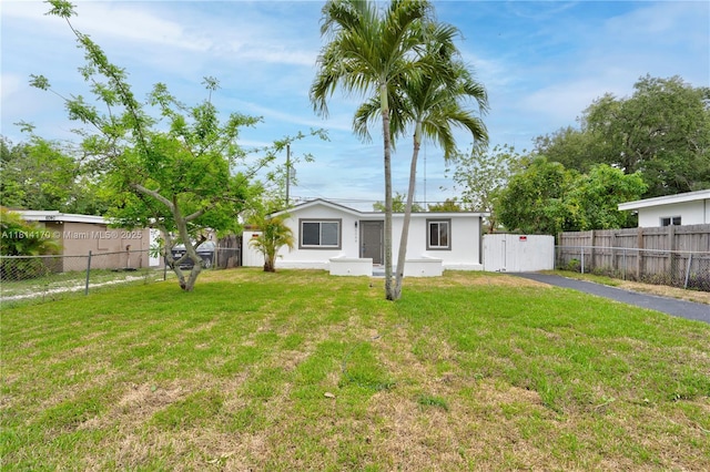 6044 SW 37th St, Miramar, FL 33023 - rear view of property featuring stucco siding and asphalt driveway