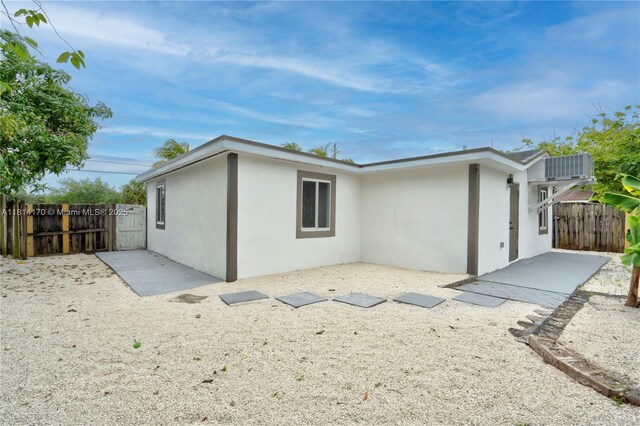 6044 SW 37th St, Miramar, FL 33023 - back of property with stucco siding and a patio area