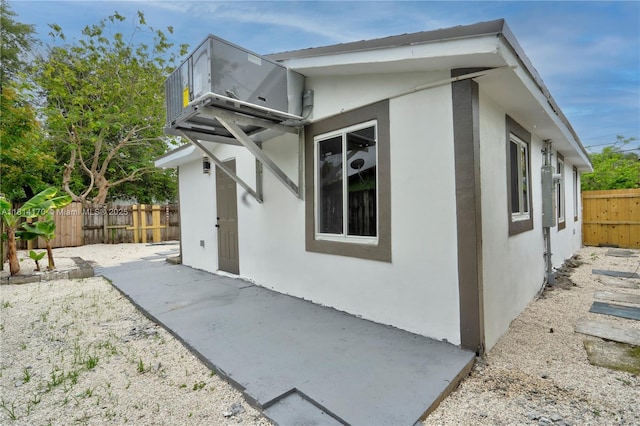 6044 SW 37th St, Miramar, FL 33023 - view of home's exterior featuring a patio, stucco siding, and a fenced backyard