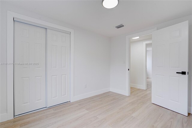 6044 SW 37th St, Miramar, FL 33023 - unfurnished bedroom with light wood-type flooring, baseboards, and a closet