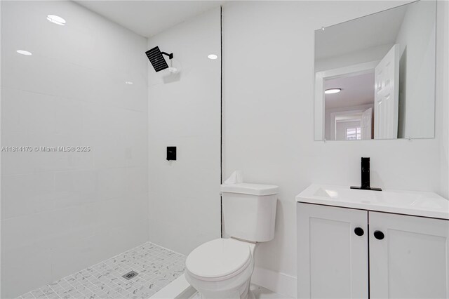 6044 SW 37th St, Miramar, FL 33023 - bathroom featuring toilet, vanity, and tiled shower