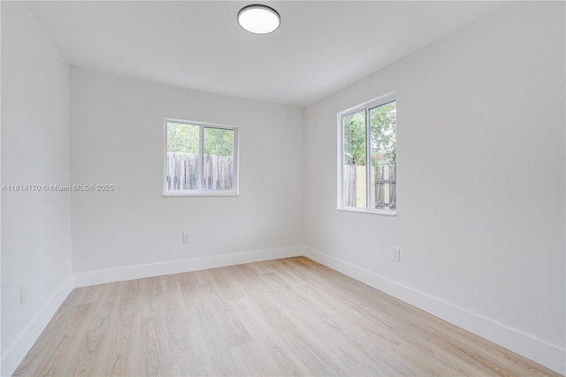 6044 SW 37th St, Miramar, FL 33023 - empty room with wood finished floors and baseboards