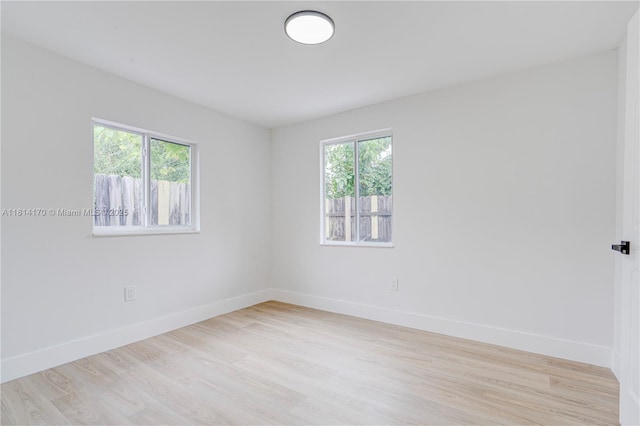6044 SW 37th St, Miramar, FL 33023 - empty room featuring healthy amount of natural light, baseboards, and light wood-type flooring