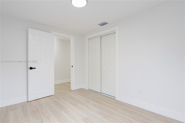 6044 SW 37th St, Miramar, FL 33023 - unfurnished bedroom featuring light wood-type flooring, baseboards, and a closet